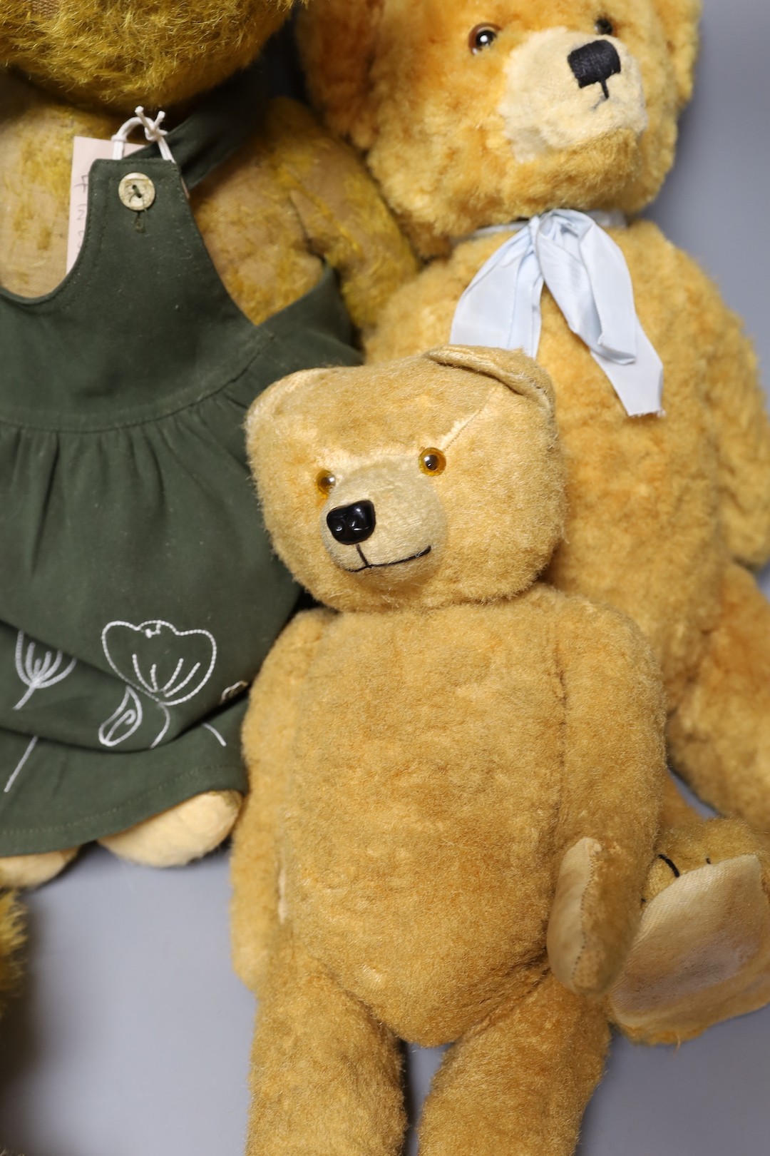 A 1930's bear in green dress, 58cm, with a synthetic European Bear, 40cm, and a synthetic european bear, 47cm, also a invicta beard, 40cm